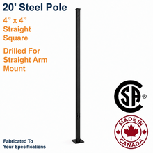 A 20-foot black steel light pole drilled for an arm mount on one side. The  pole is 4