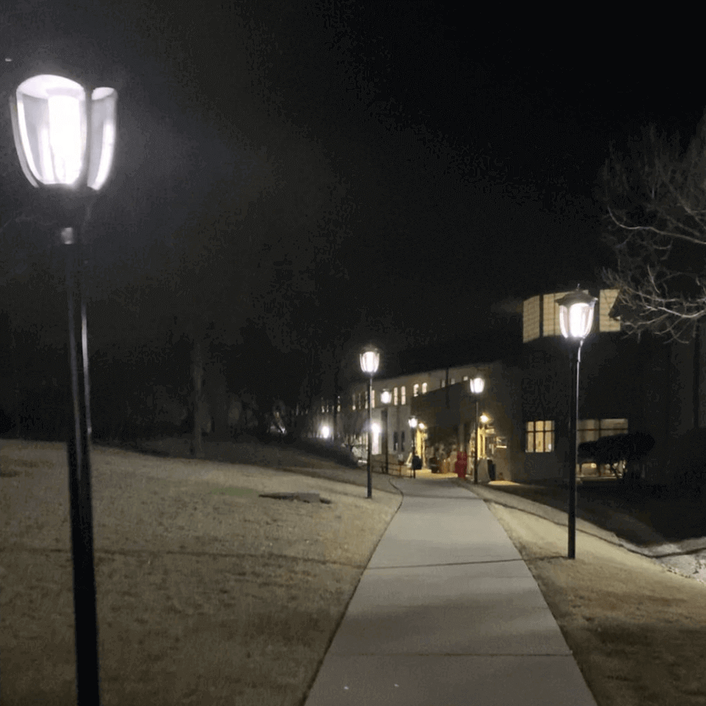 SL-SPT-20W-40K-SF-G2 Heritage Style Solar Post Top Light by Solera shown along a walkway with a mounting height of 8'. Commercial Solar Lighting from LED Network